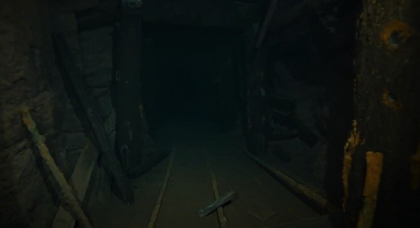 The work is admittedly dangerous — just a few old wooden beams are the only things left keeping the mine from caving in.